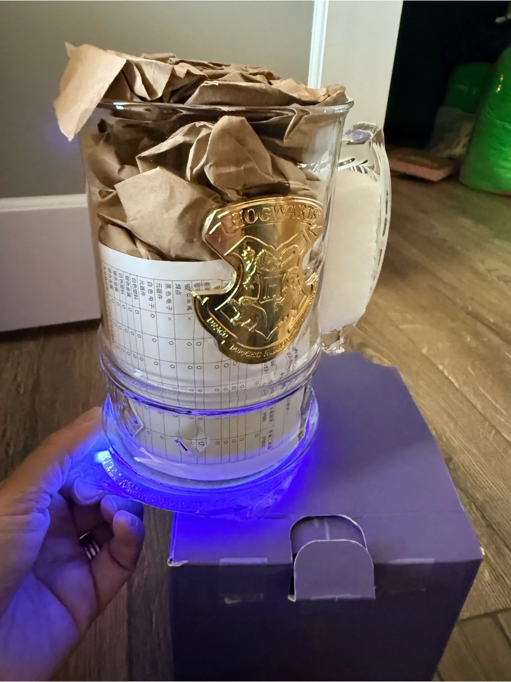 Starbucks Hogwarts Mug with Gold Accents and light on bottom